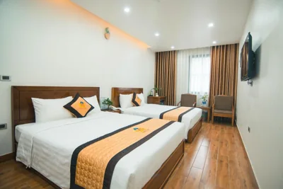 Chambre Queen Deluxe avec deux lits Queen — HOÀNG LONG HOTEL